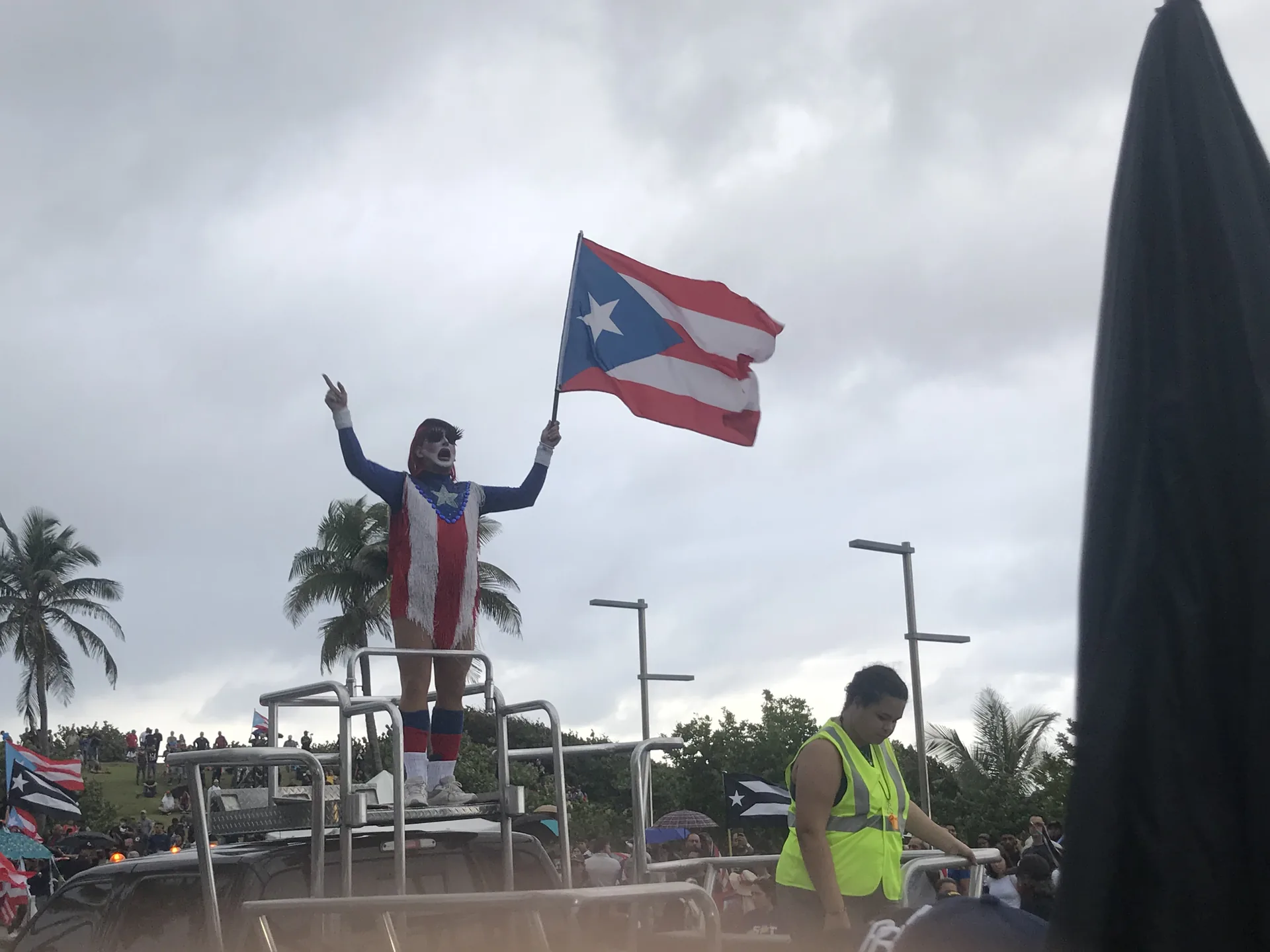 A crowd carrying Puerto Rican flags during a protest in Puerto Rico.