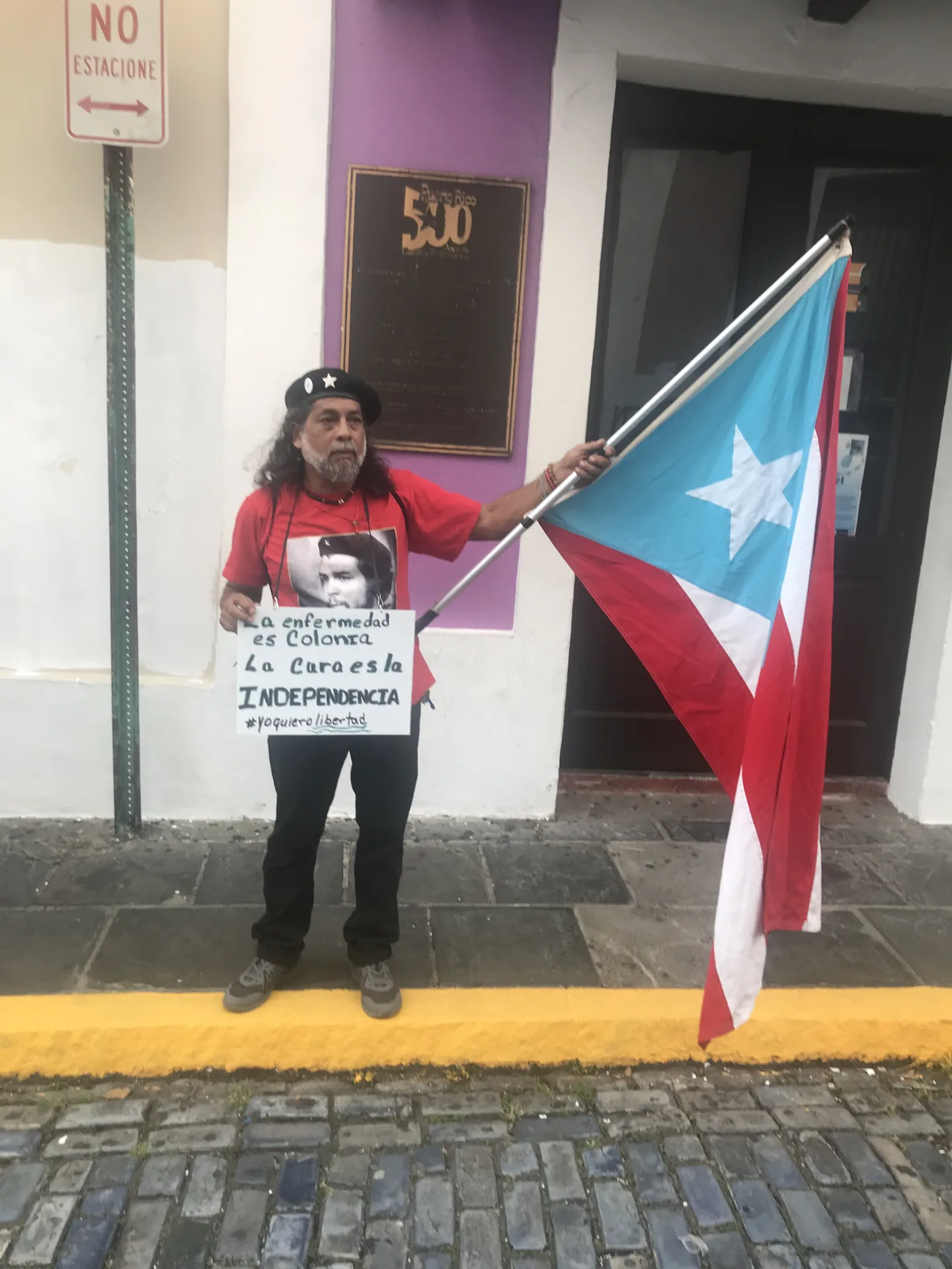 A person with a Puerto Rican flag during the protest period in Old San Juan.