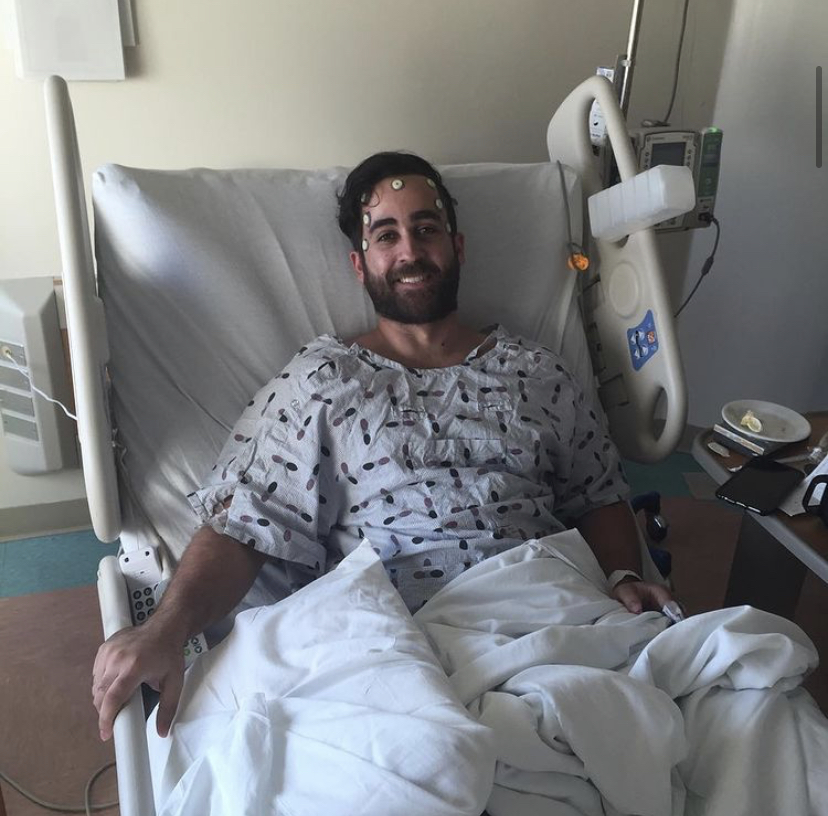 Alex Ricardo Martinez Perez recovering in a hospital bed after brain surgery